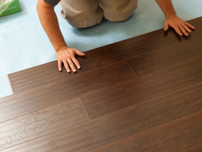 Person installing Hardwood Flooring from Carpet On Wheels in the Jamesburg, NJ area